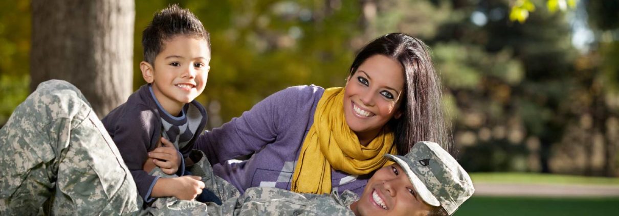 Family playing in the grass